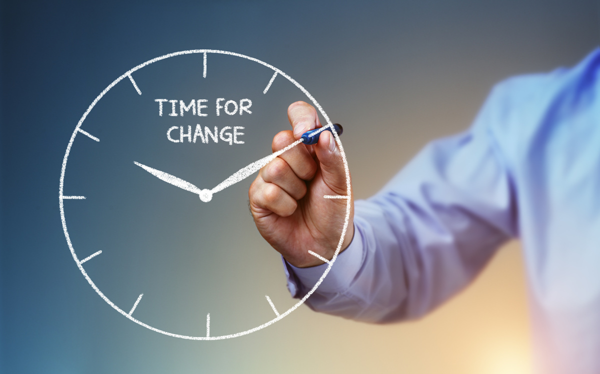 May drawing a clock face on the screen, labeled 'Time for Change'